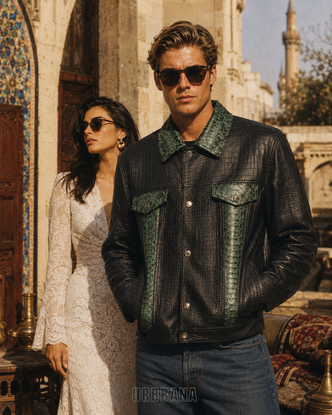 Male model wearing a black and green textured leather jacket in an outdoor campaign.