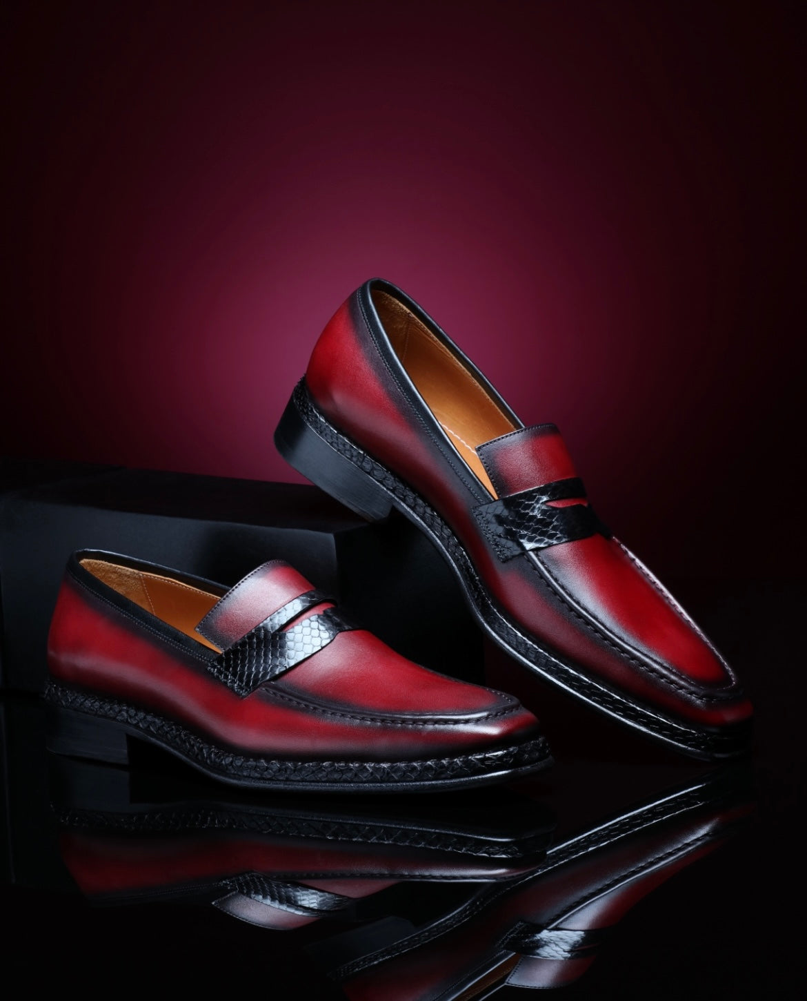 URBBANA burgundy python-skin penny loafers.