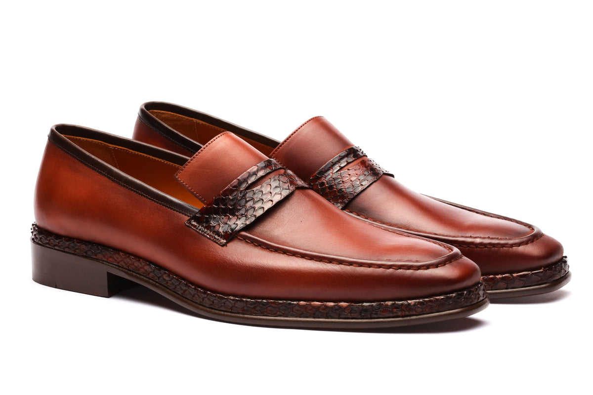 URBBANA cognac python-skin penny loafers.