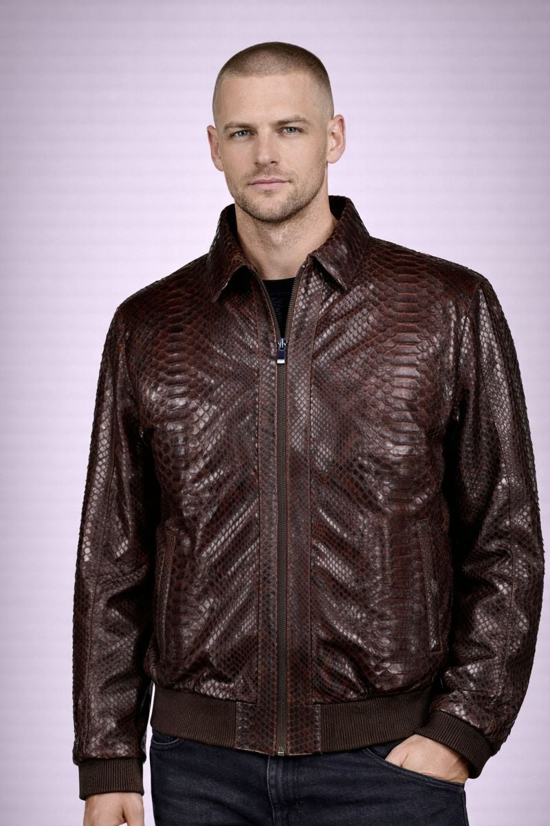 Man wearing a brown leather jacket on a light purple background