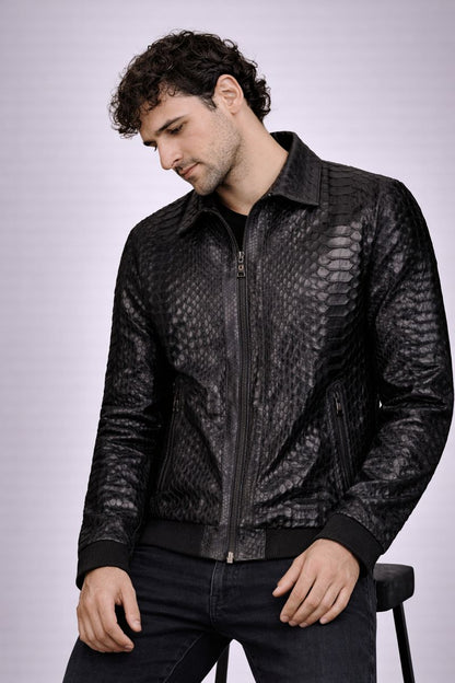 Man wearing a black python jacket on a light gray background