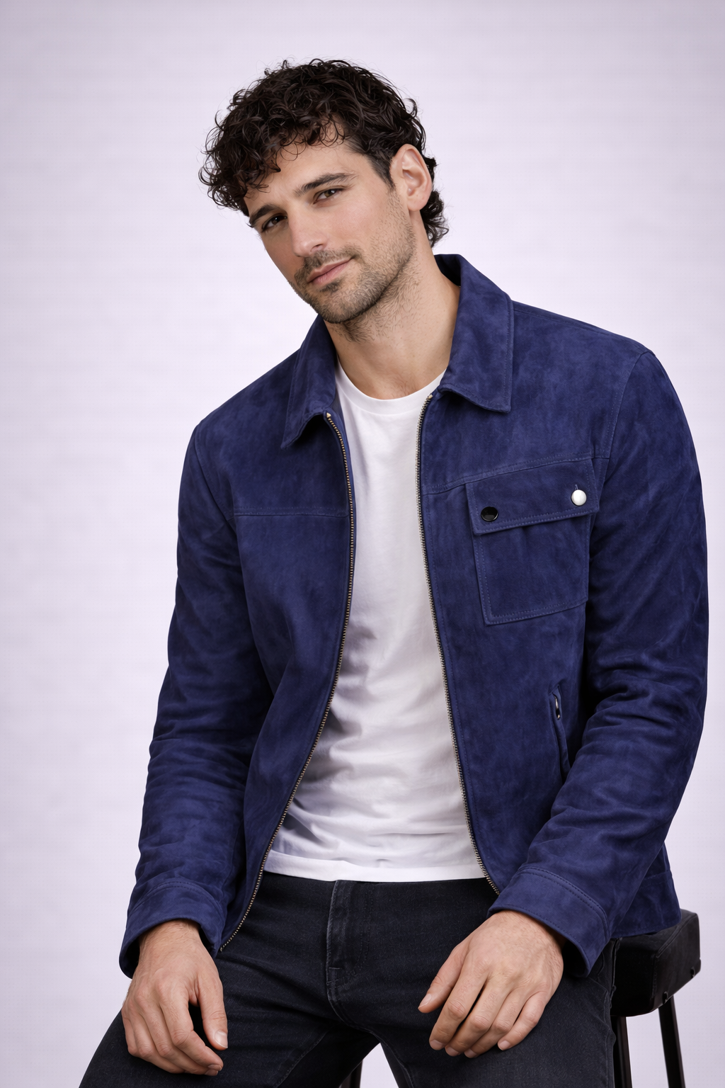 Man wearing a blue jacket over a white shirt on a white background