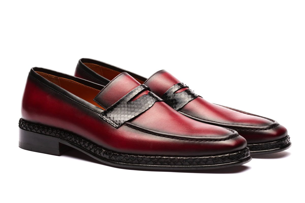 URBBANA burgundy python-skin penny loafers.
