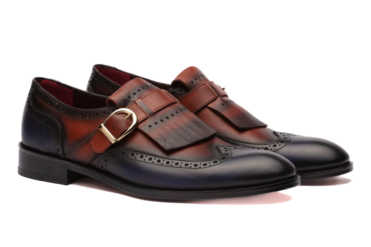 URBBANA cognac and dark-blue fringed brogue loafers.