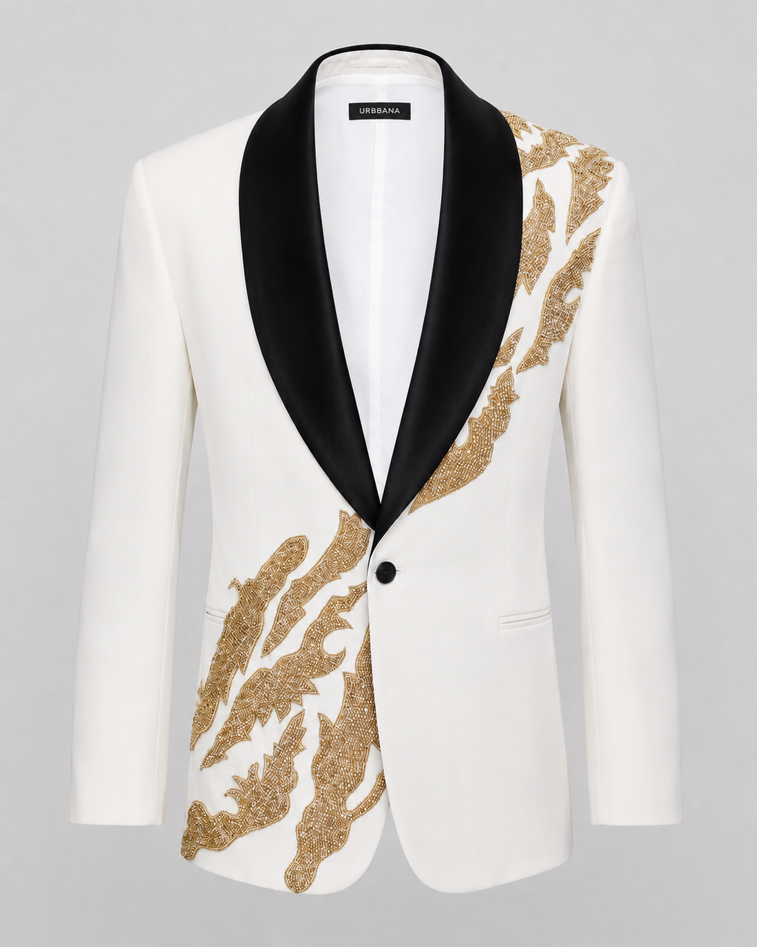 Ivory ceremony jacket with black shawl lapels and gold flame embroidery.