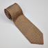Napoli silk tie with an orange and blue micro-geometric pattern.