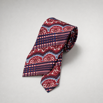 Red and navy silk necktie with paisley and striped patterns.