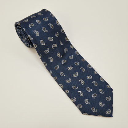 Roma silk tie in navy with small silver paisley motifs.