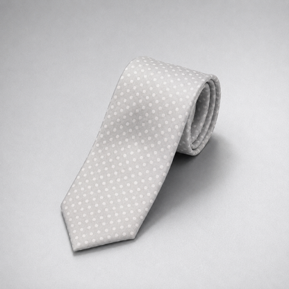 Silver silk necktie with a subtle white dot pattern on a grey background.