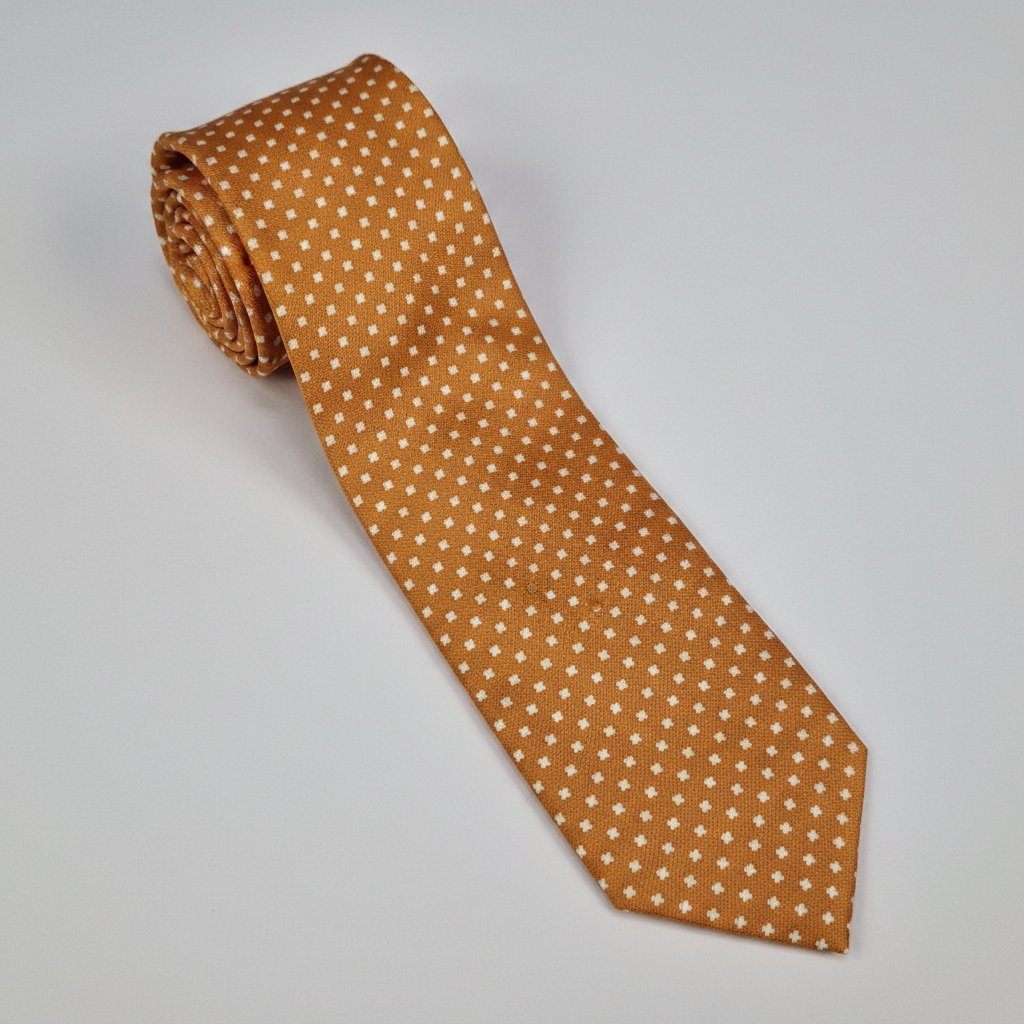 Torino silk tie in ochre with a small white dot pattern.