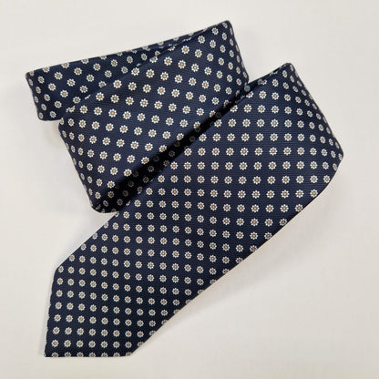 Turquoise and burgundy paisley silk tie, loosely folded.